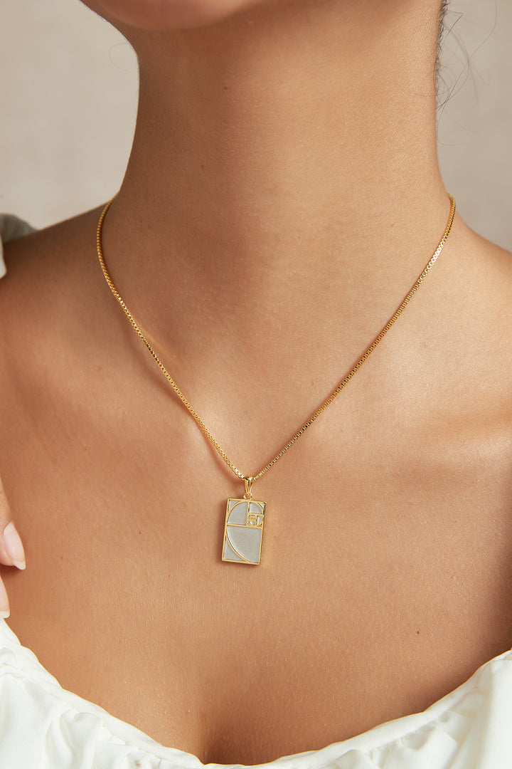 Gold and silver geometric pendant necklace worn on model - GL.rareness