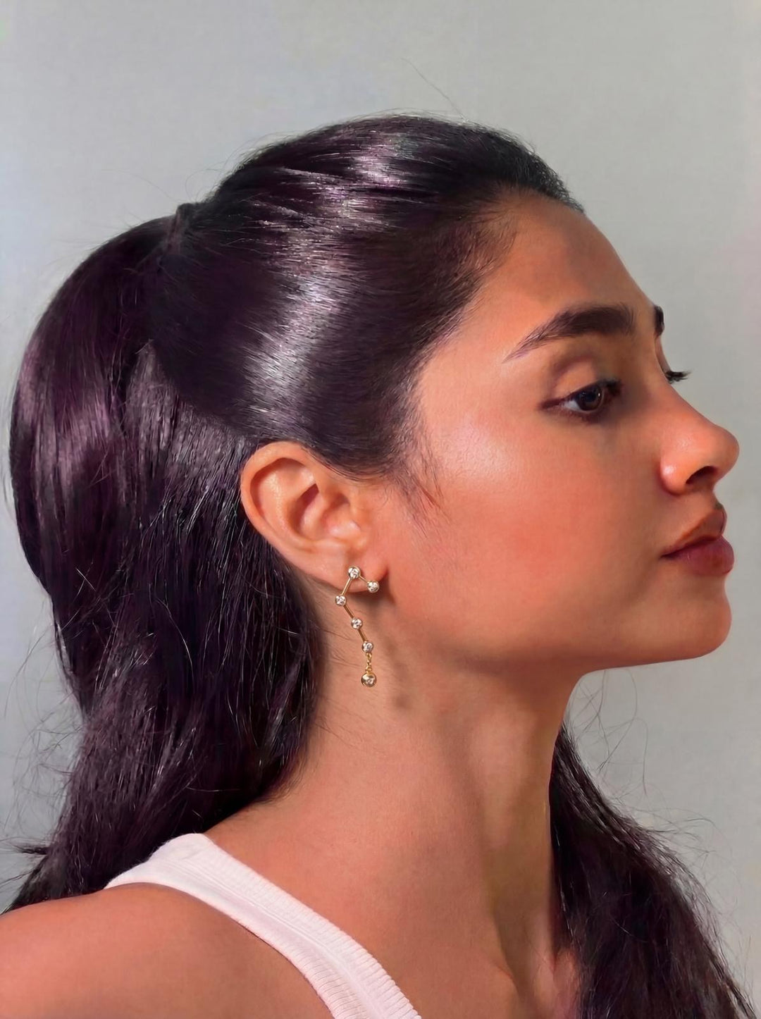Gold constellation drop earrings worn on model - GL.rareness