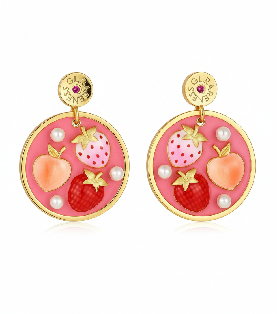 pink enamel round disc drop earrings featuring two strawberries (one light pink with red dots, one deep red with crosshatch texture) and one coral peach, accented with small white pearls and gold calyx details, hanging from branded GL.RARENESS gold disc studs with pink stone, gold bezel frame, shown as pair on white background
