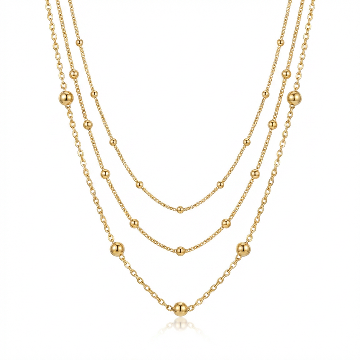 Delicate three-layered gold beaded chain necklace isolated on white background - GL.rareness